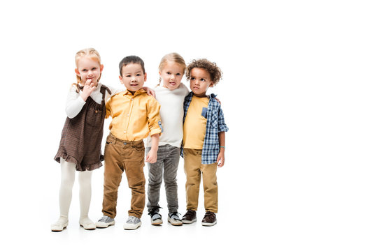 adorable multicultural kids hugging isolated on white