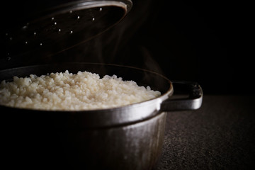 Steamed rice in iron pot 