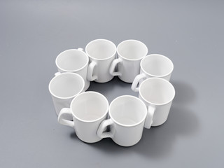 white cups for sublimation in composition on a gray background