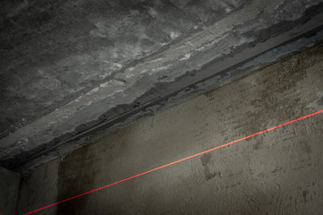 Leveling of the ceiling with plaster using beacons.