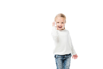 excited adorable kid talking on smartphone, isolated on white