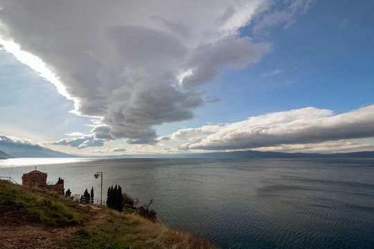 Attractive cloudy scenery over Lake Ohrid with part of the emblematic from This old town San. Kaneo Church. View from above.  Northern Macedonia.