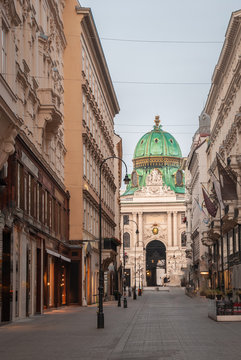 Kohlmarkt street with Hofburg Complex in early morning in downtown of Vienna in Austria with none in the street