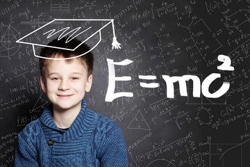 Student little boy and science background. Kid is thinking about science formula