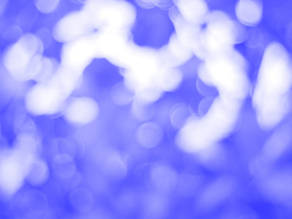 abstract blue bokeh light background. blurred cloud sky 