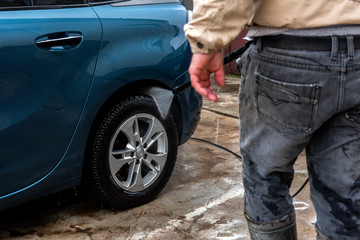 Process of car washing using high pressure water.