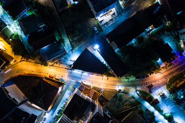 Aerial night illuminated city view Patong Thailand road skyline.Traffic aerial panorama. Clip. Bright lights of the night city. Scooter