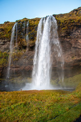Waterfall by the side of a mountain