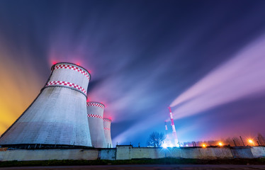 power plant night cooling towers lights smoke