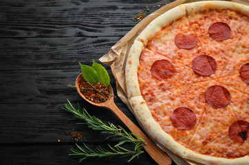 Home pizza with sausage paperoni. Top view. free space for your text.