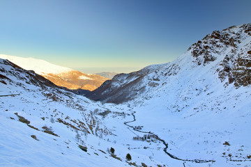 View of the high section of the Po valley, full of snow, just down the Monviso mount, in a sunny...