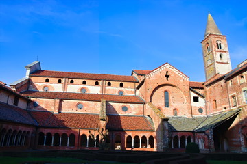 Fototapeta na wymiar Staffarda, Piedmont, Italy - January 20, 2020: View of the cloister and internal court of the Staffarda abbey, a Cistercian monastery located near Saluzzo, founded in 1135