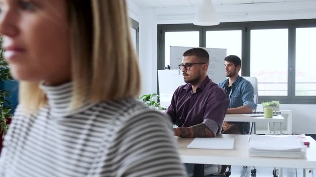 Video of software developer working with computer in the modern startup office.
