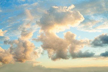 Blue sky clouds background. Beautiful landscape with clouds and orange sun on sky