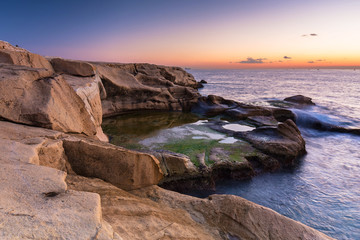 Fototapeta na wymiar Rocky coastline of Malta and Mediterranean Sea at dawn