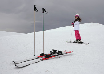 Skier girl at the snowy mountain