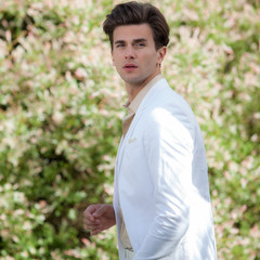 Young elegant handsome man posing outside.