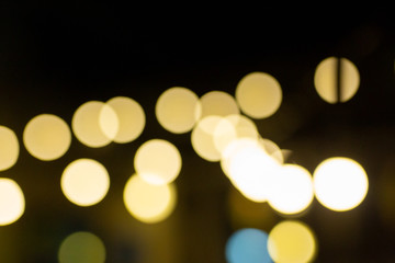 Fototapeta premium abstract yellow bokeh on black background