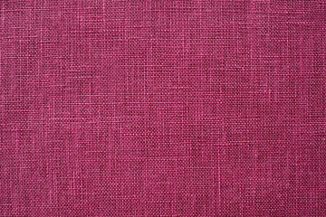 Red linen background Weaving Canvas Fabric Texture background. or Natural carmine cloth surface .