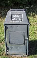 Green plastic dog litter bin