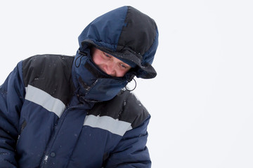 Closeup portrait of a worker on the ice of a frozen river