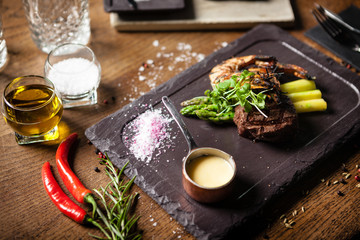 Tasting menu. Beef steak and grilled tiger prawns.