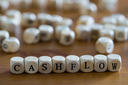 Cashflow Written With Woodem Cubes