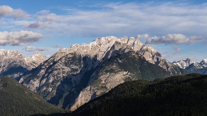 Fototapeta na wymiar Mountain range with forest in Italian Dolomites.