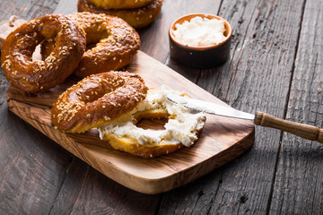 Bagels sandwich with cream cheese on wooden table