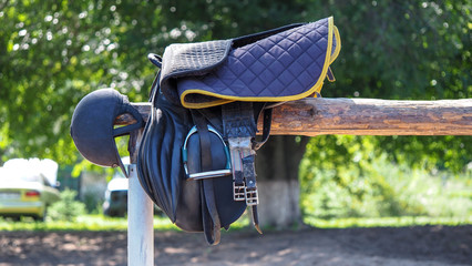 Saddles harnesses made of handmade leather. Leather equipment for riding horses - obrazy, fototapety, plakaty