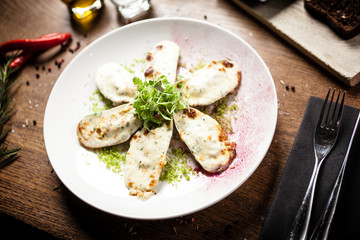 Cooked green mussels with parmegano and cream cheese