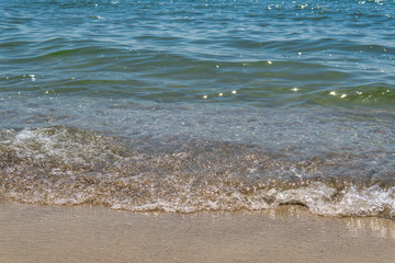 Soft wave of the sea on the sandy beach