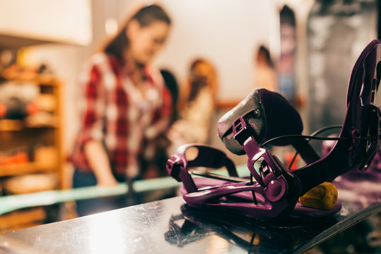 Selective Focus Of Snowboard Binding And Snowboard In Repair Shop