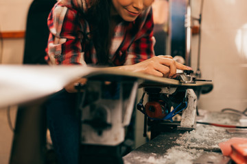 Fototapeta na wymiar cropped view of worker repairing ski in repair shop