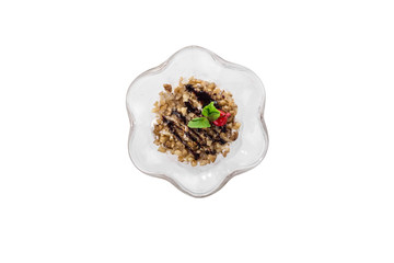 Glass of fruit and yogurt parfait with peanuts and cherry isolated on white background