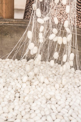 boiling silkworm cocoons to produce silk rope
