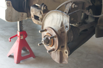 Car disc brake showing dust cover and brake caliper without disc plate, Car service.