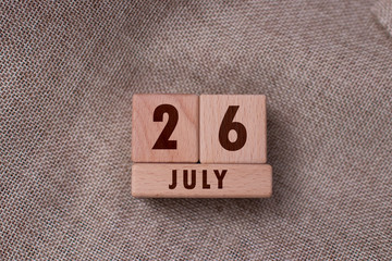 July 26 written with wooden blocks