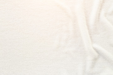 White towel texture for background. That fabric or textile consist of cotton fiber material. Look plush, fluffy, dry, soft and clean. For background about baby, spa, hotel, laundry and hygiene etc.
