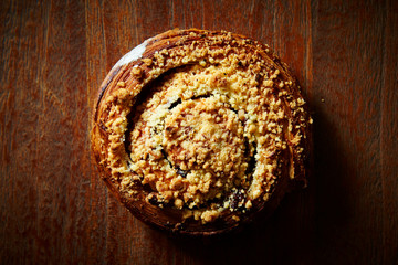 Sweet danish bread roll on wooden background 