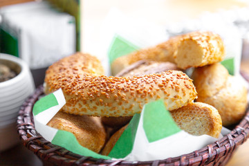 Turkish simit in the bowl with soft focus frame and accent on the simit.