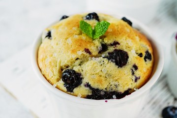 Homemade Blueberry Muffin for one baked in a ramekin, selective focus