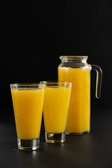 as fresh sliced orange slices on a black background