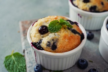 Homemade Blueberry Muffin for one baked in a ramekin, selective focus
