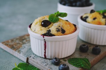 Homemade Blueberry Muffin for one baked in a ramekin, selective focus