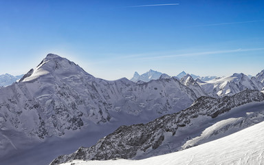 Fototapeta na wymiar Swiss alpine peaks landscape panorama of Bern Highland with Matterhorn at horizon helicopter view