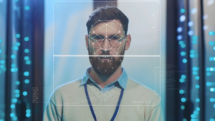Future. Face ID. High Tech Biometric Facial Recognition. Technological 3D Face Scanning of Bearded IT Administrator with Laptop Working at Data Center Secure Storage. Augmented Reality.