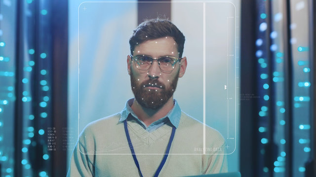 Future Face Detection. Face ID. High Tech Biometric Facial Recognition. Technological 3D Face Scanning of Caucasian Bearded Administrator Working at Data Center Cyber Security. Augmented Reality.