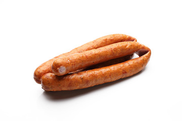 Rings of smoked pork sausage isolated on a white background.