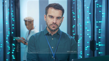 Face ID. 3D Looped Animation for Face Detection. Technological Biometric Future Scanning of Face of Caucasian IT Specialist Working in Server Room of Data Center. Cyber Security and Personal Safety